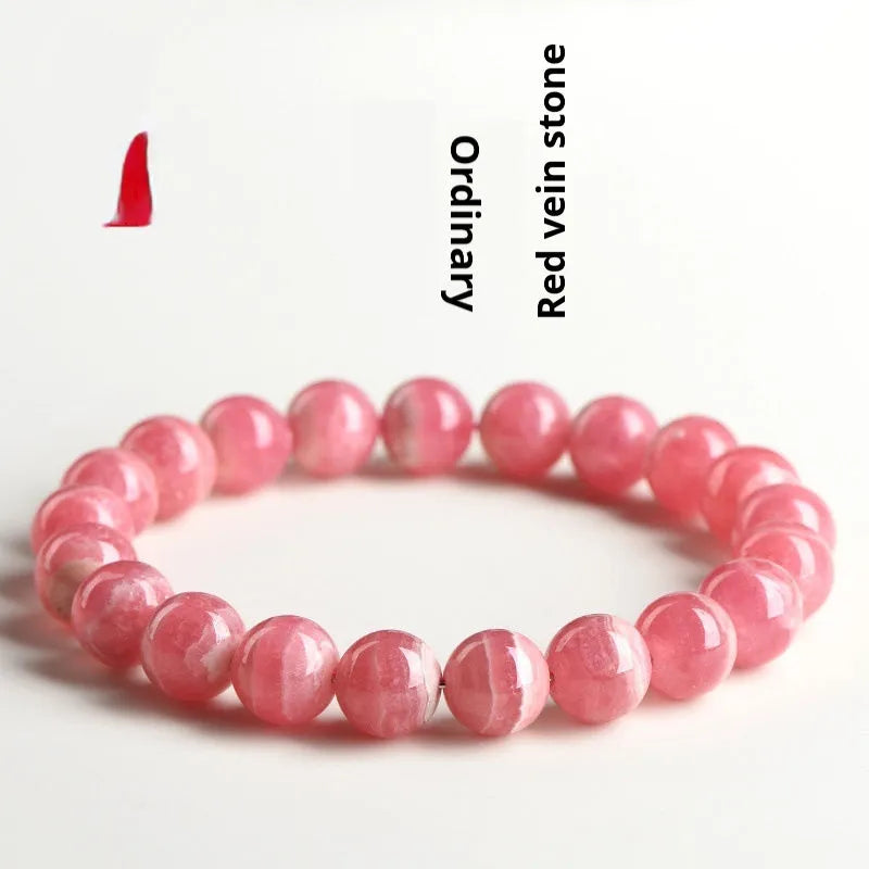 Women's geometric crystal bracelet with a Longevity Lock and red rhodochrosite stone beads.