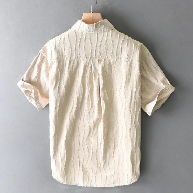 Men's apricot and army green pure cotton short-sleeve casual shirt on a hanger.