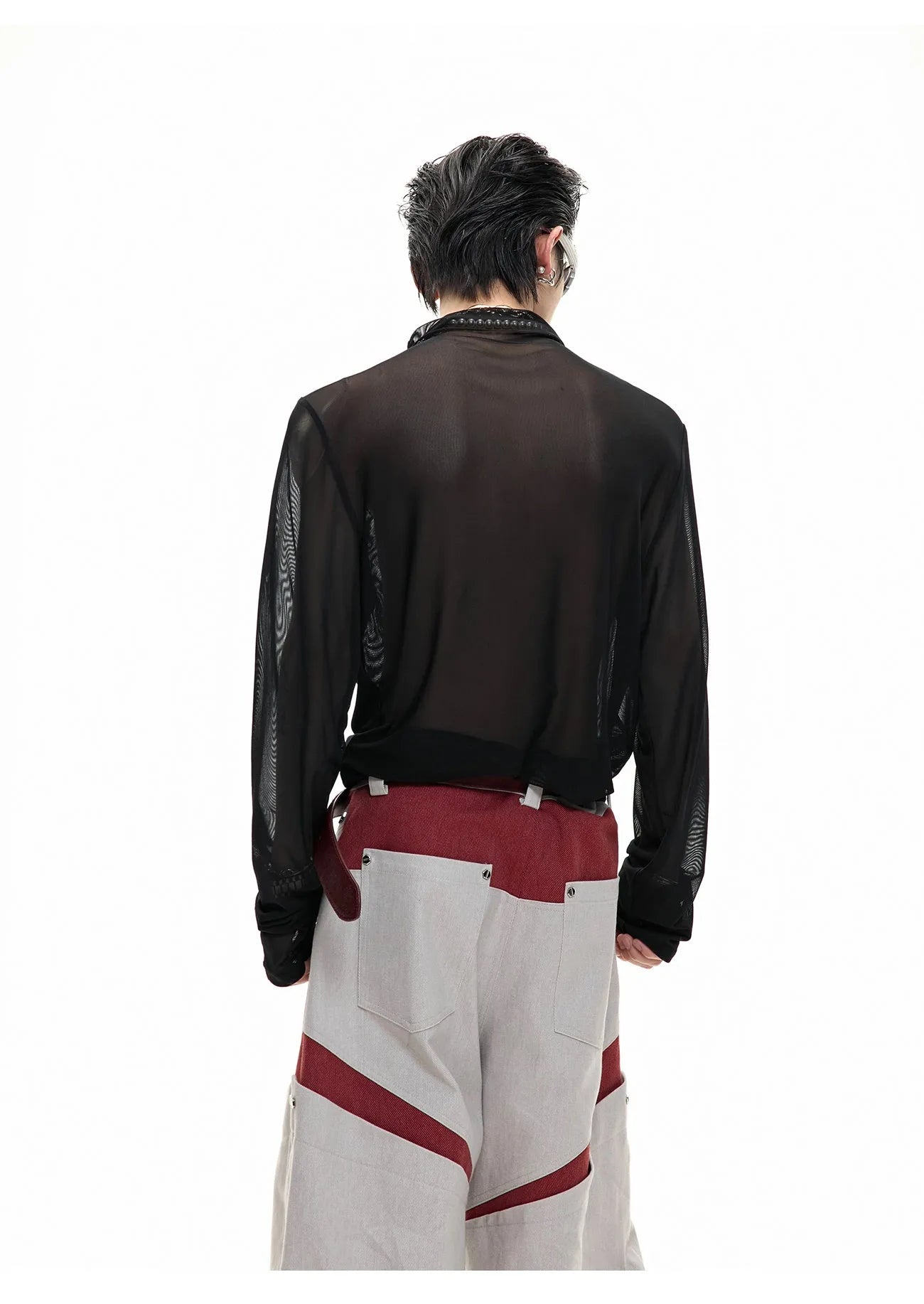 Black mesh slim-fit long sleeve bottoming shirt on a hanger, showing its lightweight texture and close cut.