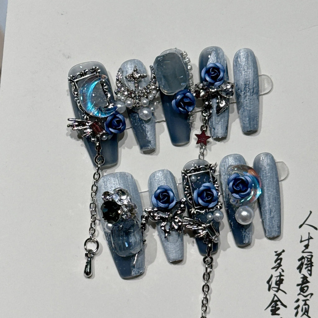 Heavy industry blue night manicure set with rose and tulip floral designs on plastic armour suit.