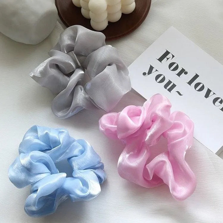 Korean style cloth hair ring with crystal satin finish in light pink colour on a white background