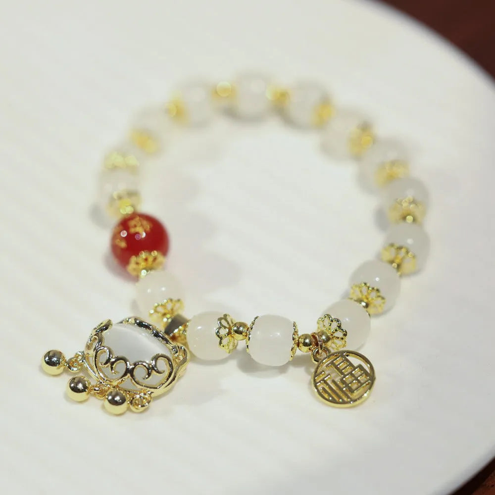 Women's Chinese style glass bracelet with safety lock, fu character, windmill, bamboo, and jade charm elements