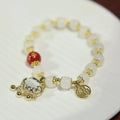 Women's Chinese style glass bracelet with safety lock, fu character, windmill, bamboo, and jade charm elements