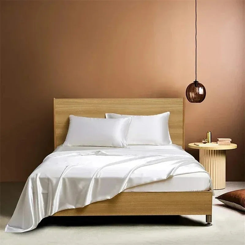 Four-piece imitation silk bedding set with satin weave in Navy Blue on a bed