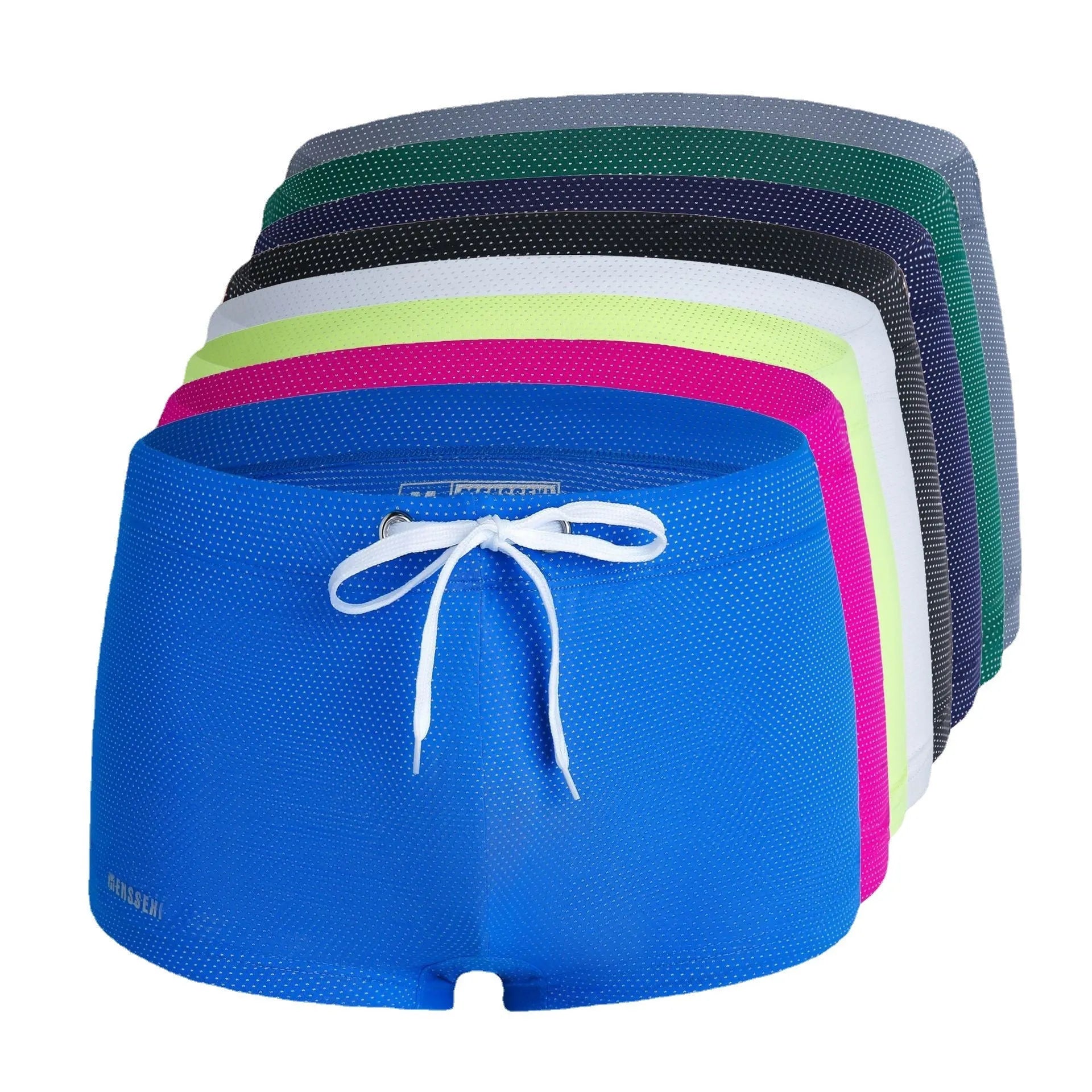 Men's solid colour low waist swimming trunks in nylon, shown in multiple colours including fluorescent green and black.