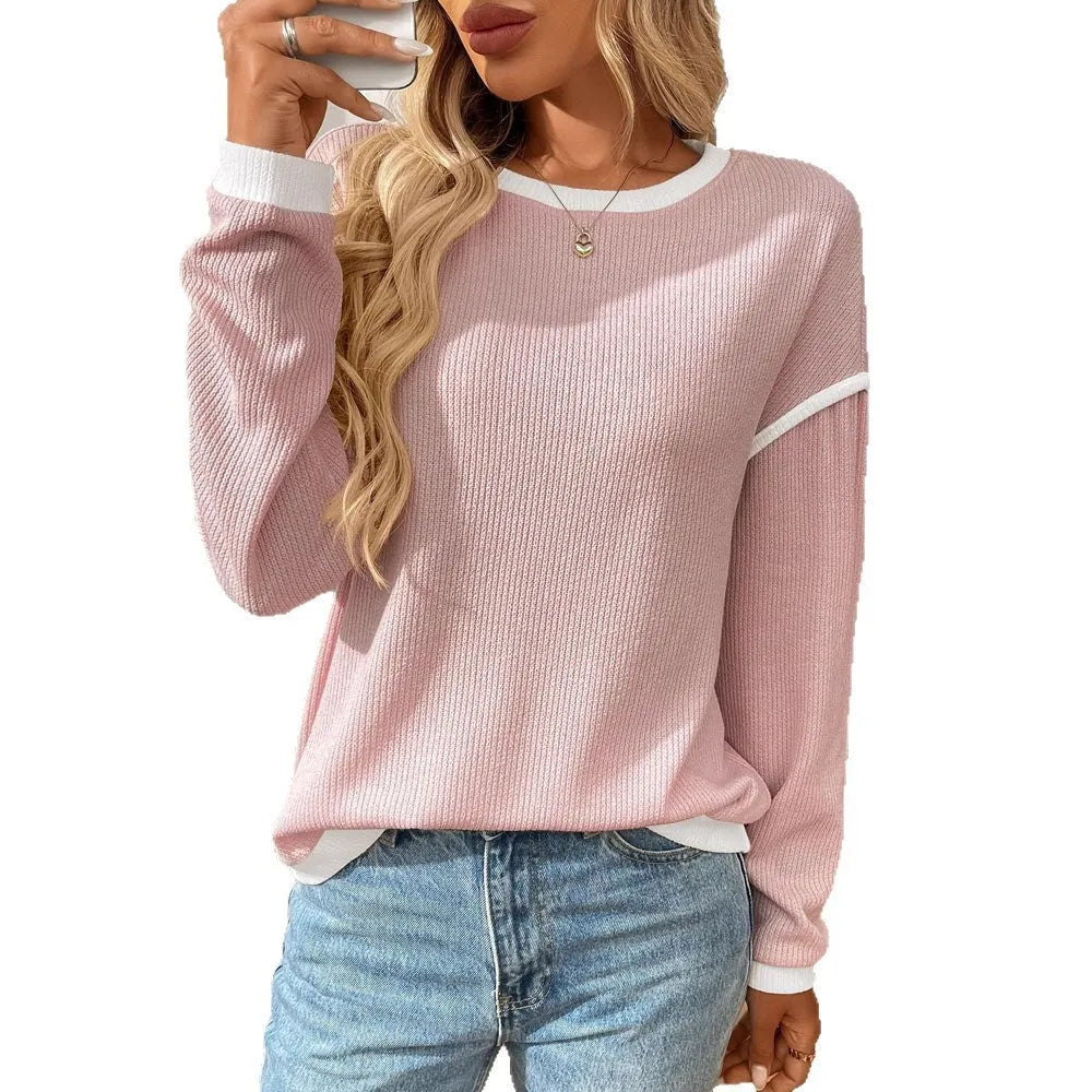 Women's loose-fit long sleeve round neck pullover top in light blue polyester fabric.