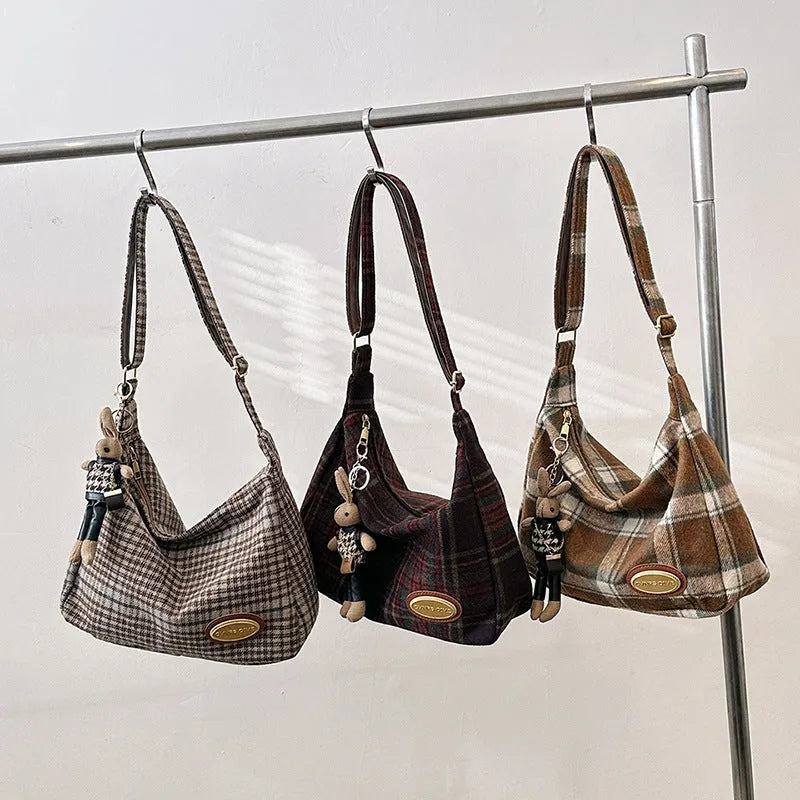 Women's large soft woolen cross-body shoulder bag in a horizontal square shape, shown in a choice of colours.