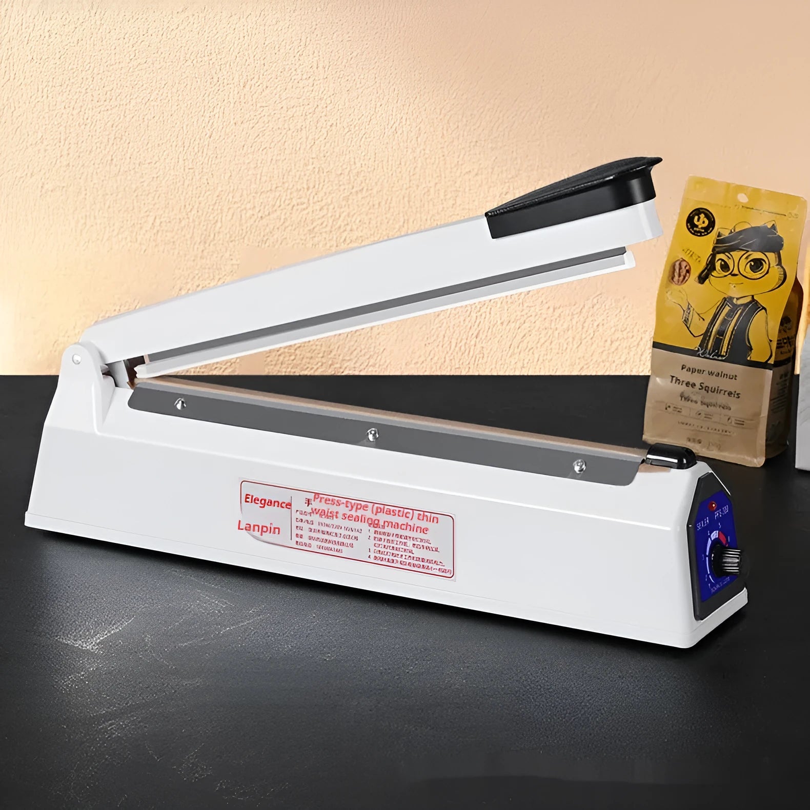 Heat film heat shrinkable bag sealing machine with 40cm sealing length and hot air gun on a workbench