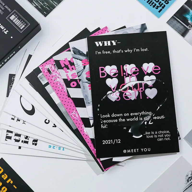 Box containing two different fresh-style postcards with printed messages.