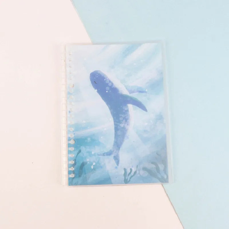 Children's hand-ledger notebook with hardcover showing animal designs including whale and fruit patterns