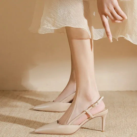 Apricot women's high-heeled sandals with a buckle toe strap, shown with a rubber sole.