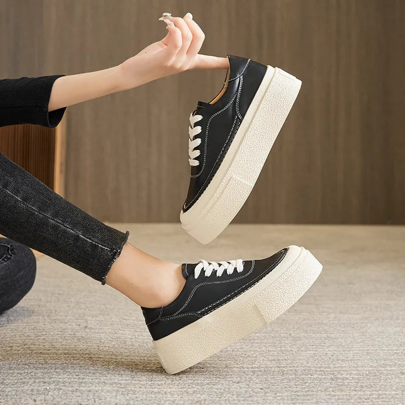 Women's black and white platform sports board shoes with embossed cowhide uppers and round toe design