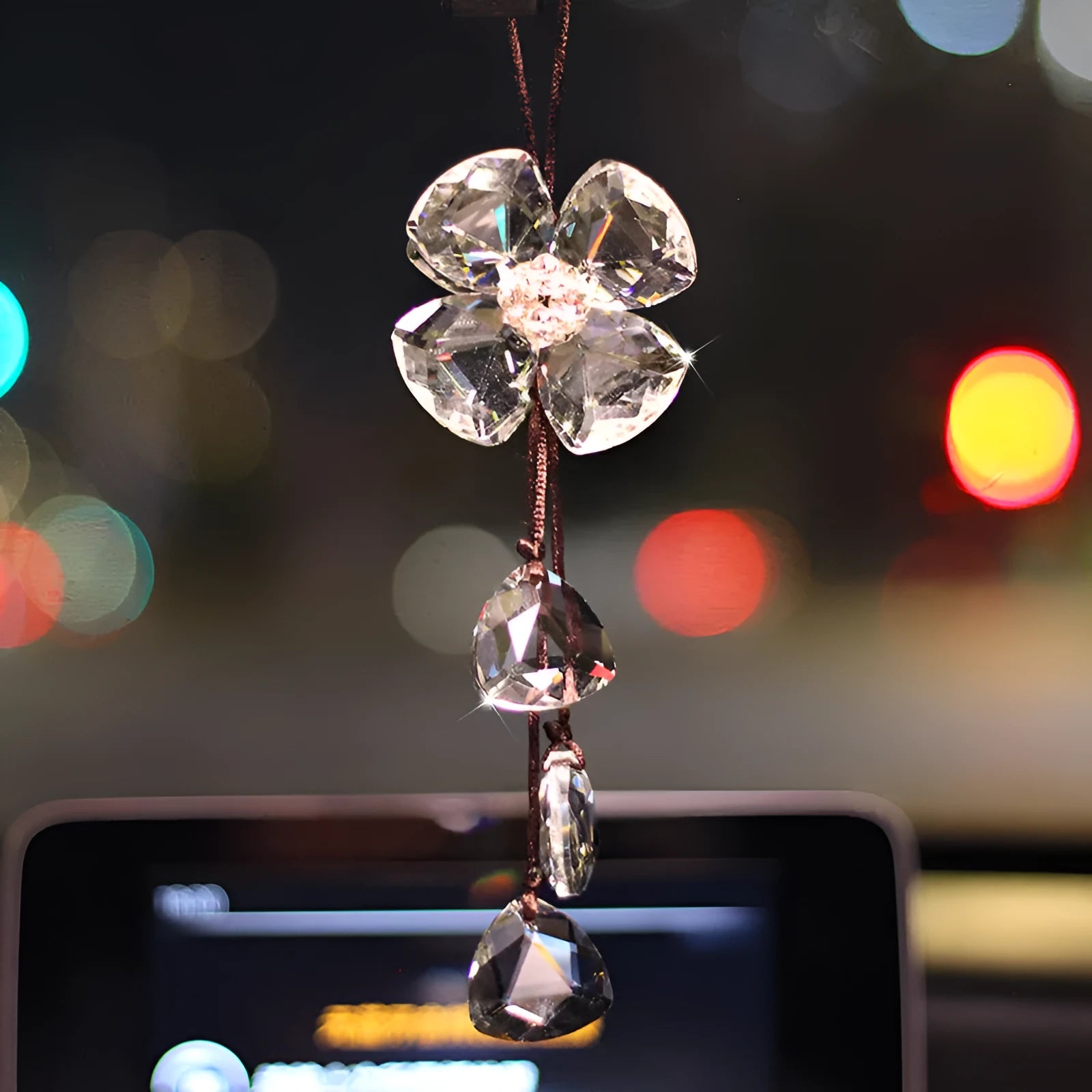 Crystal Four Leaf Grass car interior hanging pendant approximately 20cm long on a clear background.