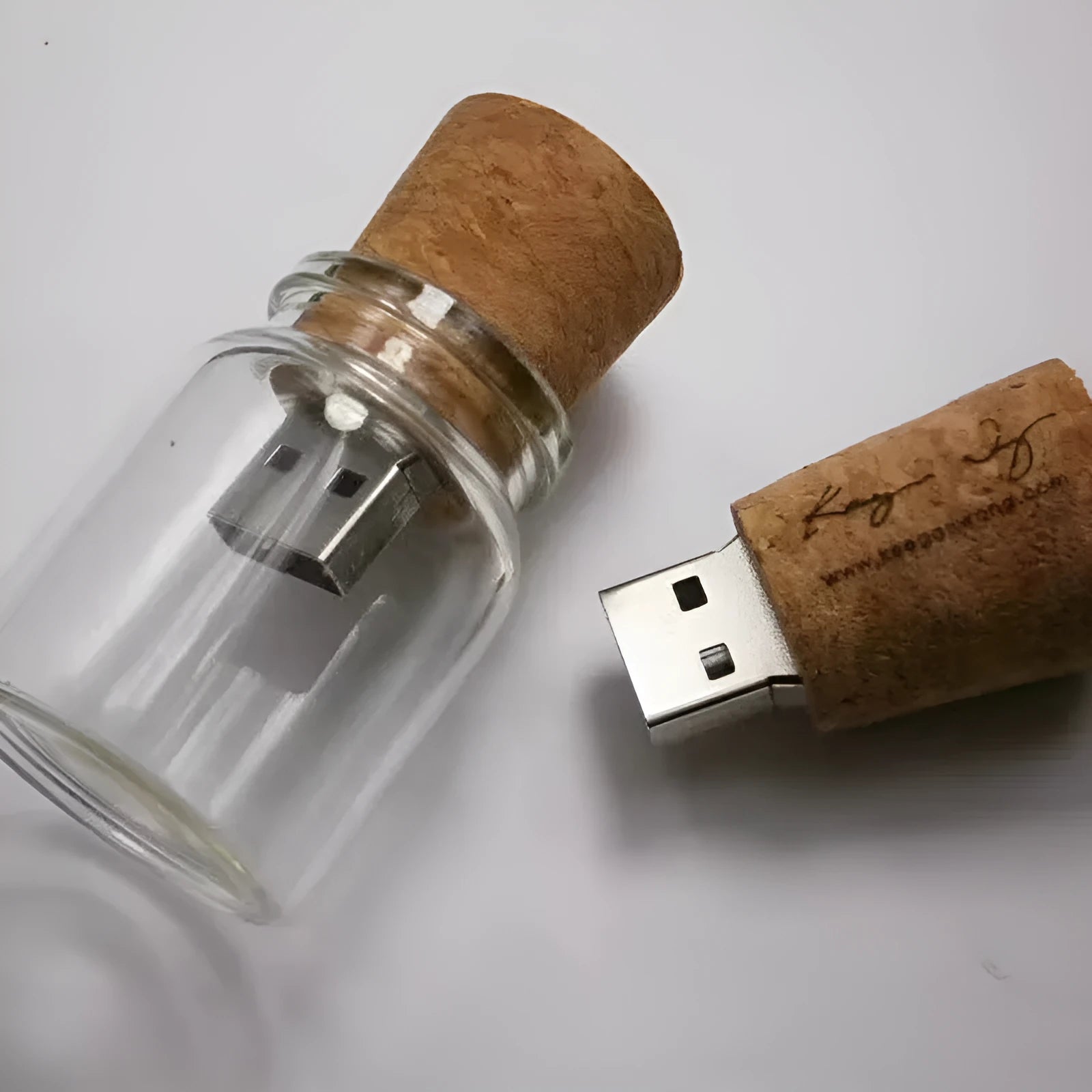 Wooden bottle-shaped USB flash drive on a keyring with transparent finish showing wood grain.