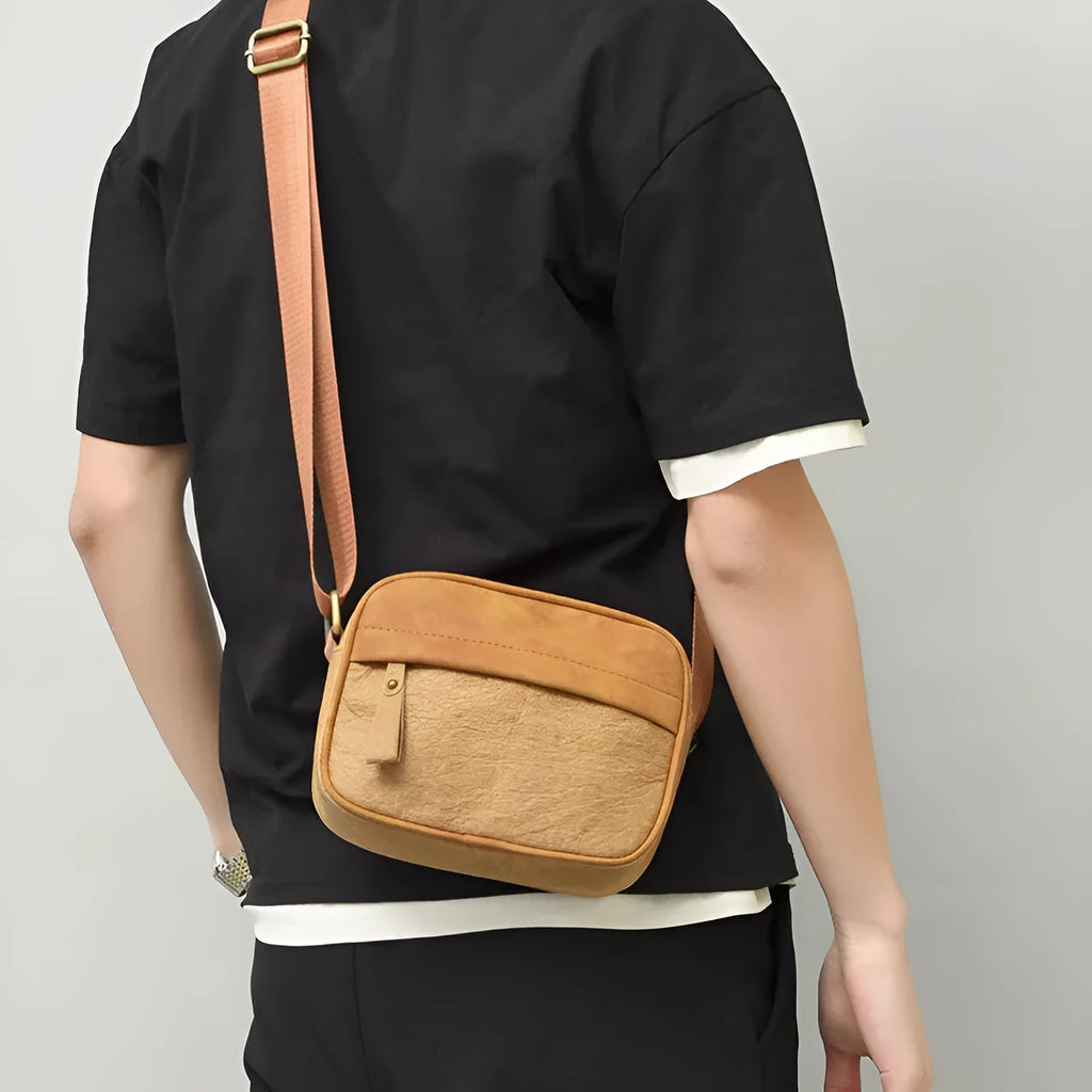 Men's waterproof paper crossbody bag in European and American retro style, shown in black colour