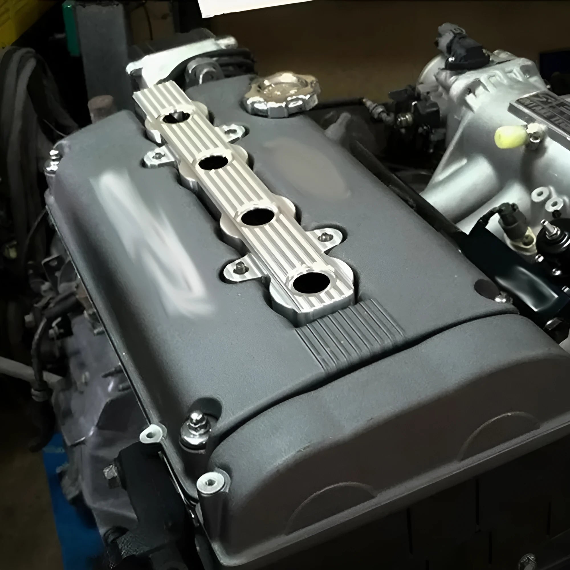 Aluminium alloy engine cover in blue, red, and silver colour options