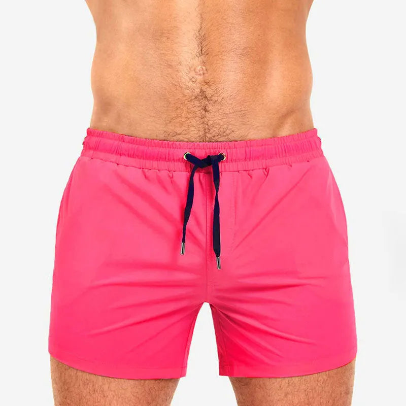 Men's solid colour polyester sports shorts with mesh lining in six colour options