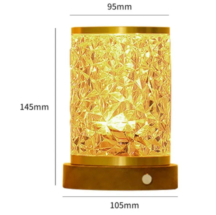 Small rotating water ripple night light with an acrylic shade on a solid wood base.