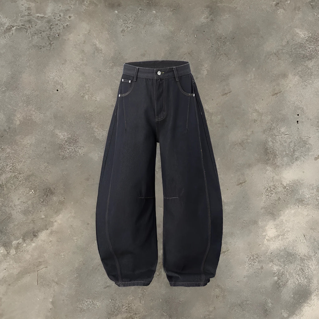Men's wide leg denim trousers in original cow colour showing relaxed fit and mid waist design.