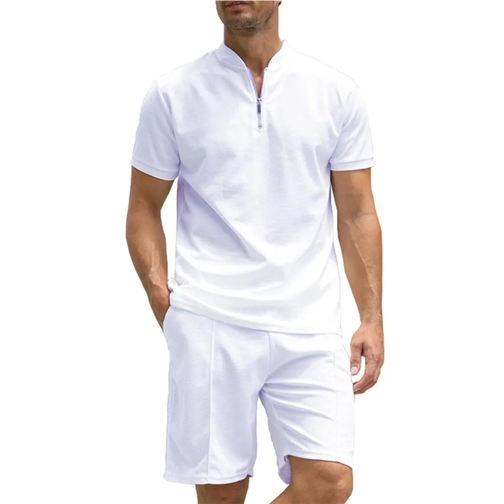 Men's solid colour polo shirt and matching trousers two-piece suit set on a hanger.