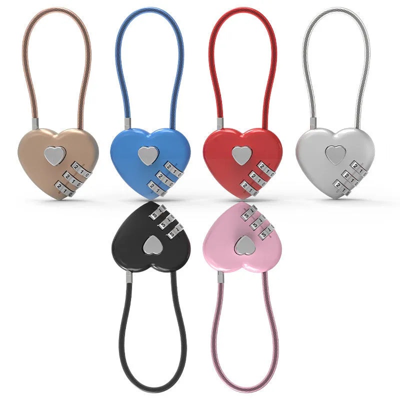 Peach heart shaped combination lock with a long black steel cable, shown in blue plastic.