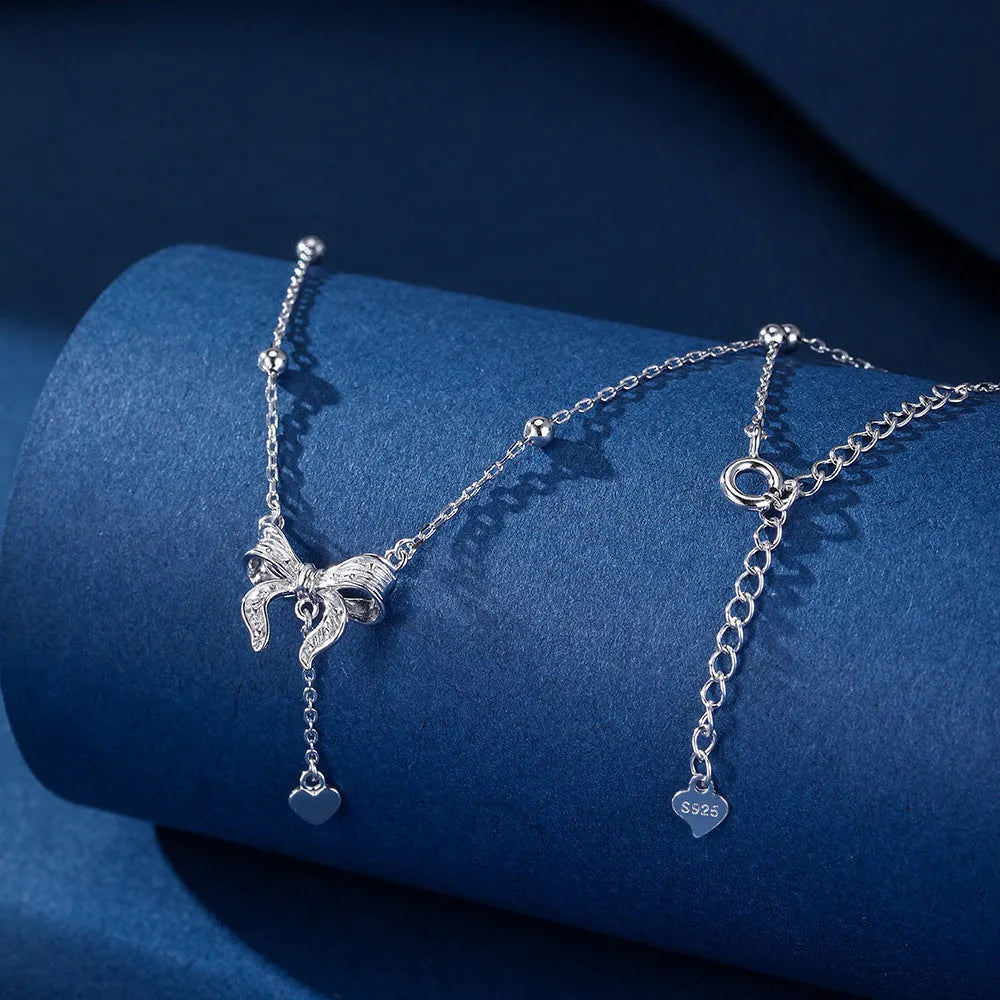 S925 silver adjustable clavicle chain with heart pendant featuring butterfly and bow design