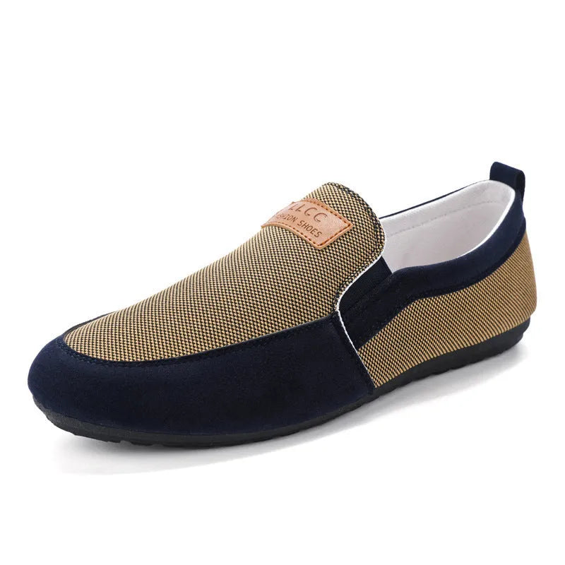 Men's grey canvas casual board shoes with round toe design and rubber soles shown from side view