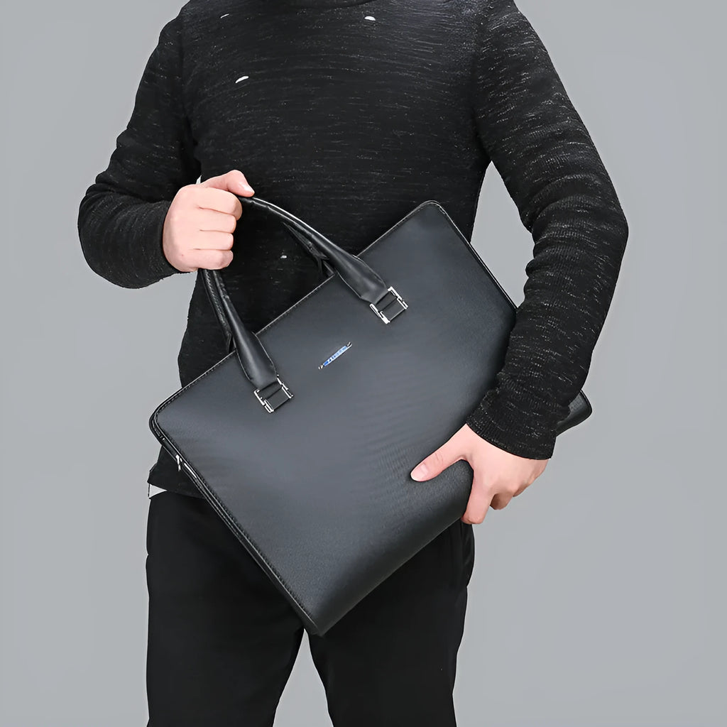 One-shoulder cross-slung male business briefcase in black PU leather horizontal square shape with stitching detail