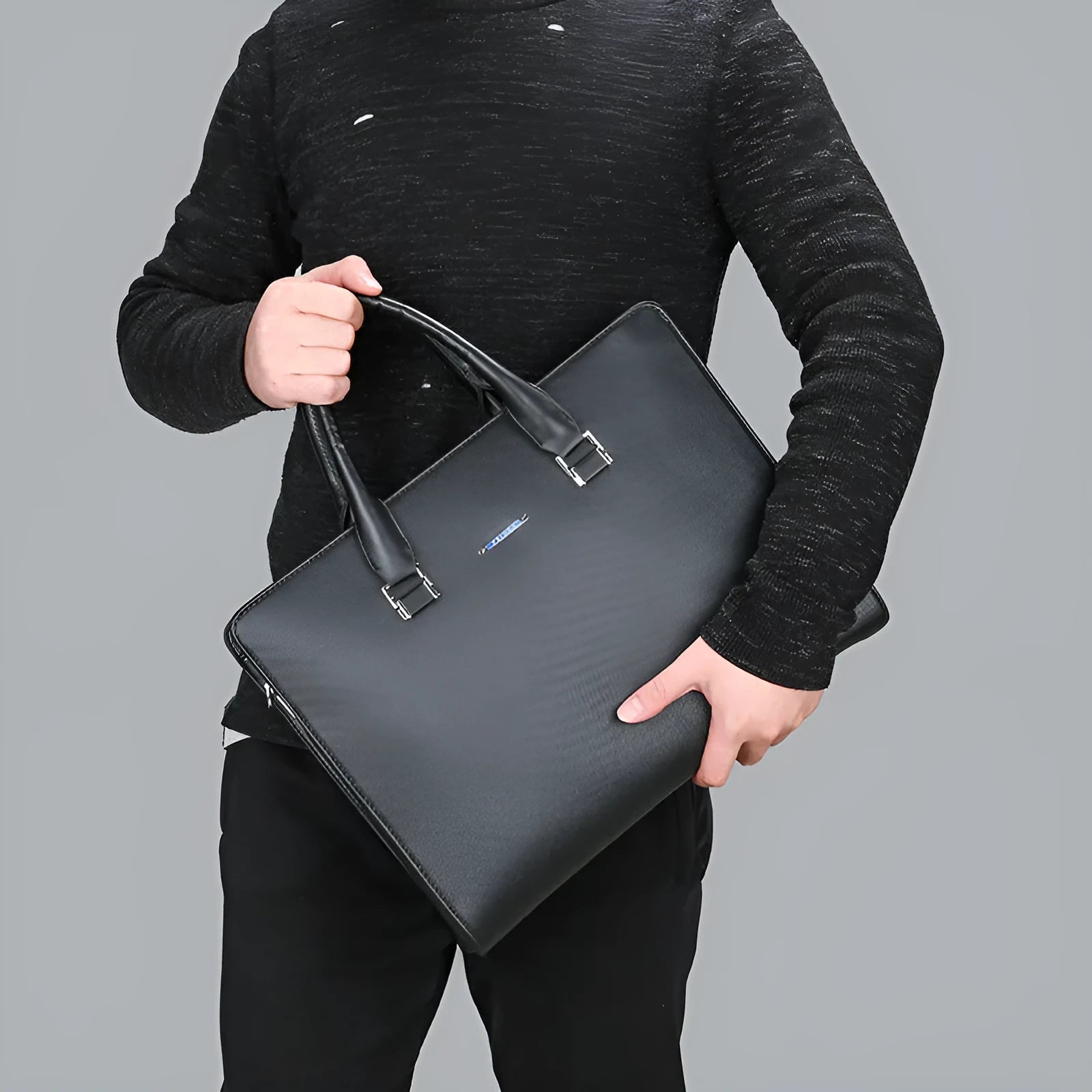One-shoulder cross-slung male business briefcase in black PU leather horizontal square shape with stitching detail