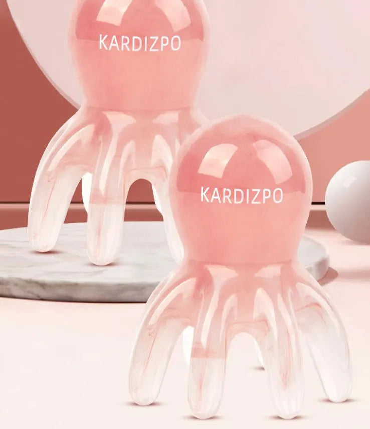 Pink octopus-shaped facial massage comb for periocular meridian stimulation with storage bag
