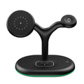 Black vertical magnetic three-in-one wireless charging stand with phone attached and watch charger folded out.