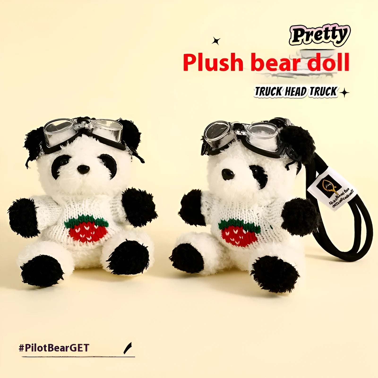 Cute plush strawberry bear doll keychain pendant on a soft surface, showing the cartoon bear with strawberry sweater design