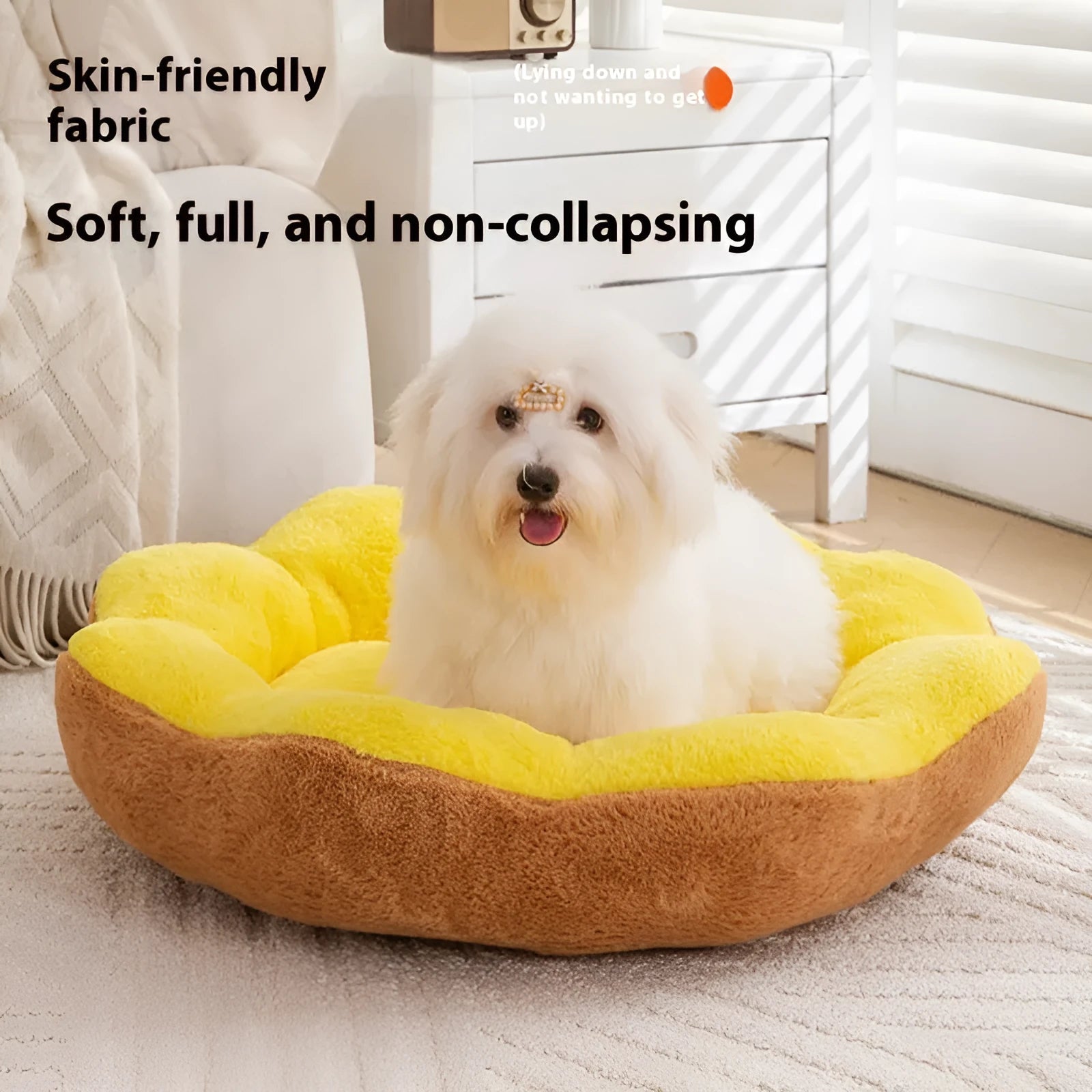 Round grey and black cloth cat bed with thick sides and a soft, detachable rabbit plush decoration on the rim.