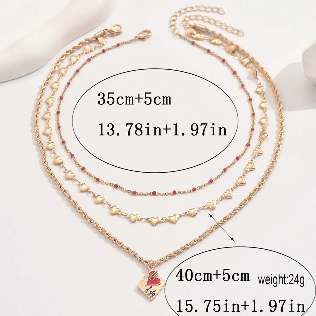 Three-layer clavicle necklace with geometric heart pendants on adjustable chain