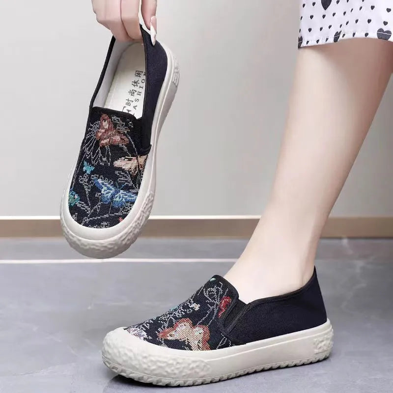 Women's canvas slip-on shoes with plastic injection-moulded sole and decorative sewing thread details