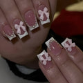 Set of 24 short French manicure false nails with white tips, bow designs, tulip patterns, and leopard print on a European square shape.