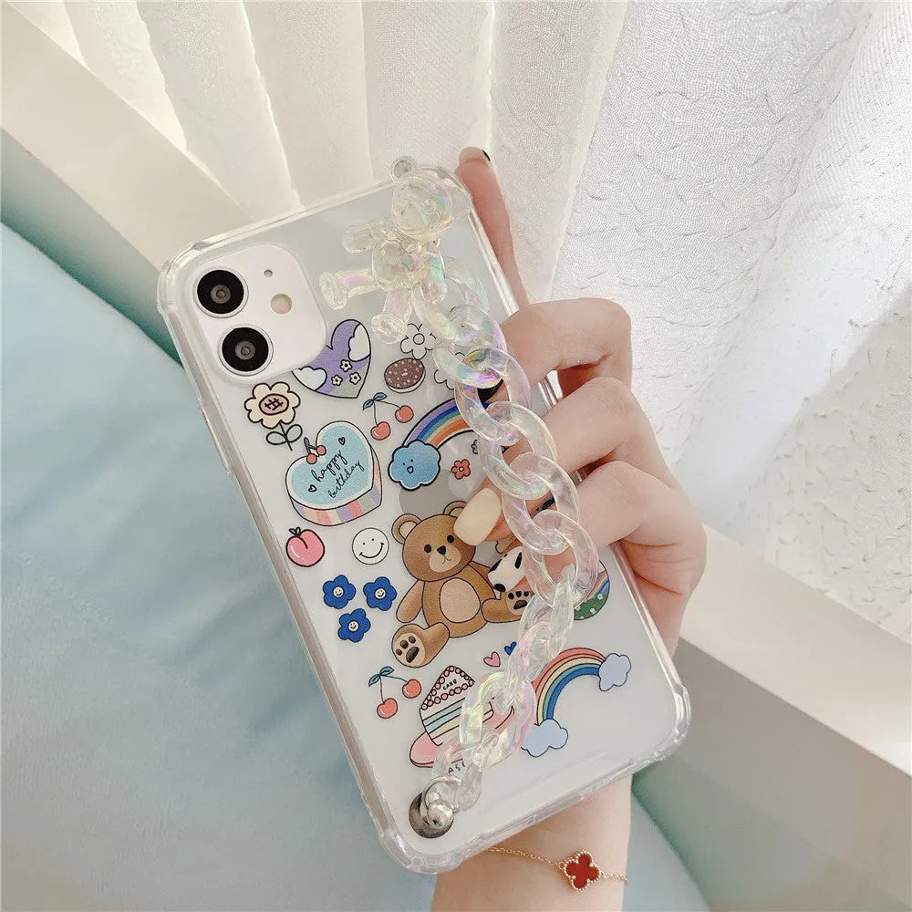 Transparent TPU iPhone case with bear chain and pendant attachment showing phone protection