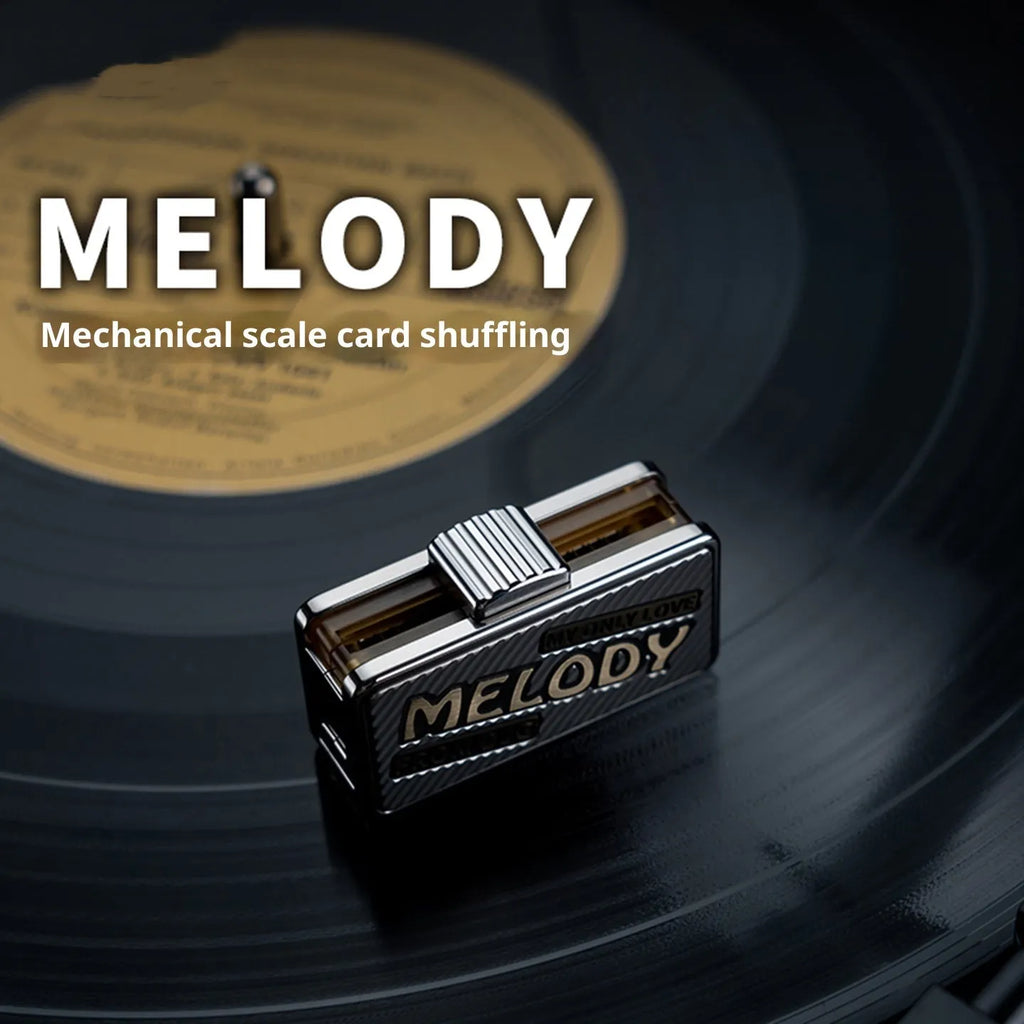 Titanium alloy mechanical scale push EDC fingertip decompression toy in Melody colour shown on a desk