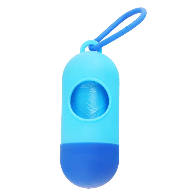 Compact black dog poop bag holder with a metal side hook and a grey Velcro adjustment strap.
