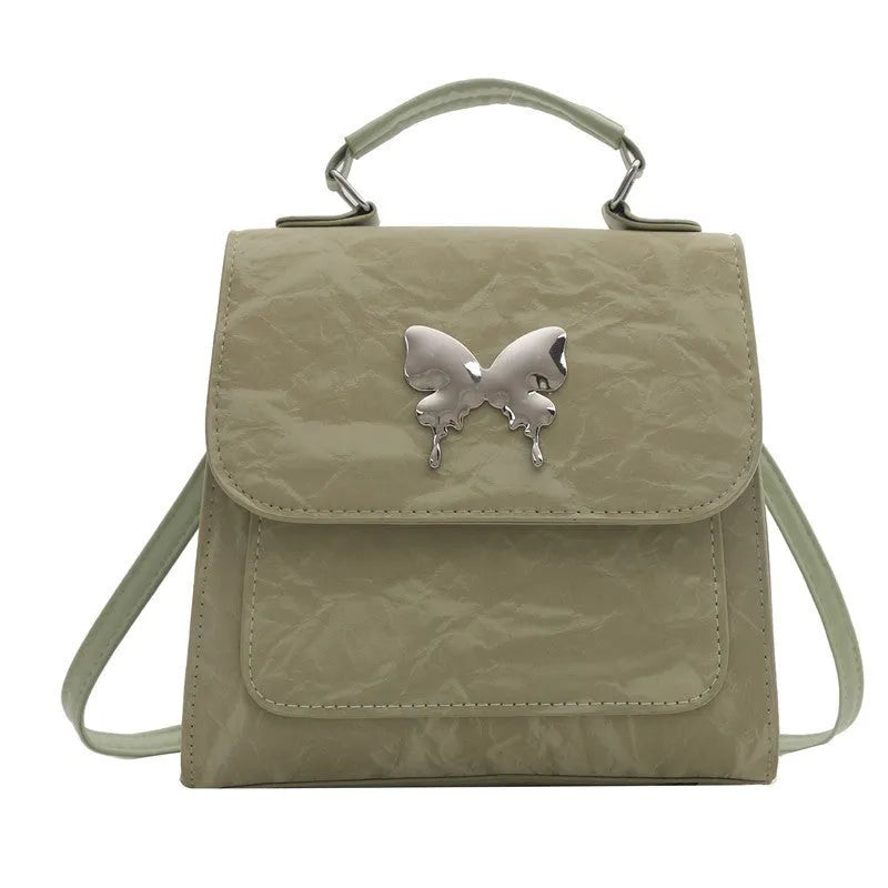 Women's preppy style PU backpack handbag with bow detail in light blue colour