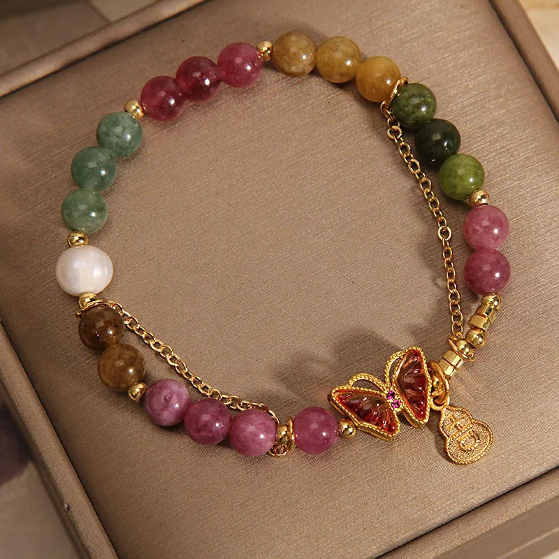 Natural jade coloured agate bracelet with butterfly and gourd pendant.