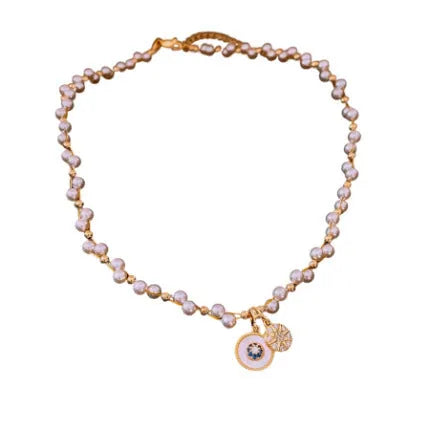Gold electroplated necklace with round zircon and imitation pearl pendant on clavicle chain