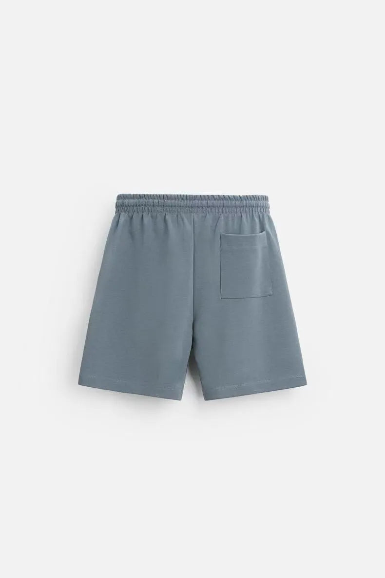 Double-sided cloth texture loose short sleeve top and matching shorts co-ord set on a hanger.