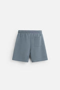 Double-sided cloth texture loose short sleeve top and matching shorts co-ord set on a hanger.