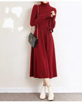 Turtleneck knit dress with elastic waist and long sleeves in solid colour