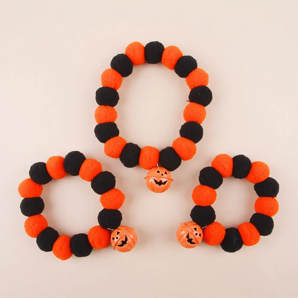 Halloween pumpkin pet collar with adjustable band, satin ribbon bow, and bell for cats and small dogs