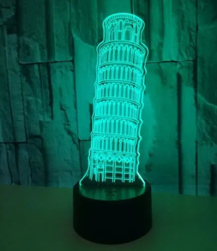 3D laser-cut Leaning Tower of Pisa acrylic night light glowing in blue on a black base.