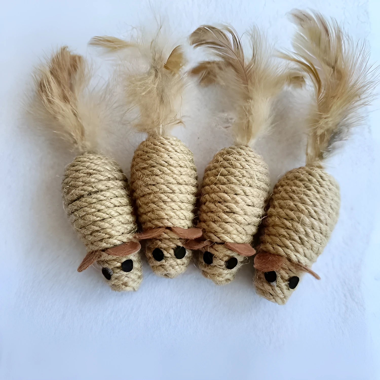 Bite ball molar pet toy made from cotton strips and sisal rope, shown as oval sisal mouse