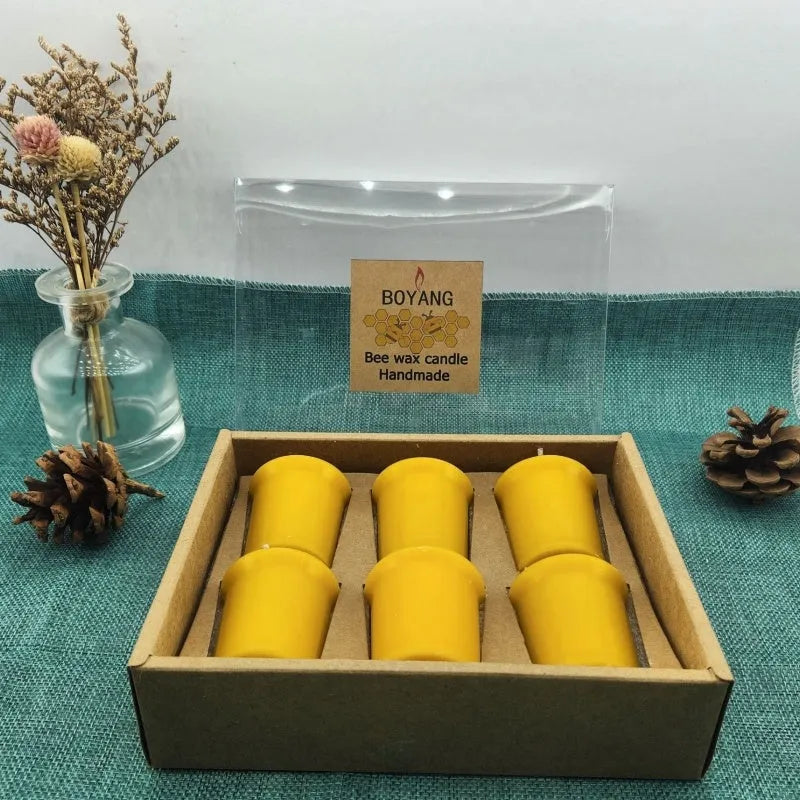Six handmade beeswax and soy wax candles in cup shape, beeswax colour, 4.6cm x 5.2cm each, arranged on a surface