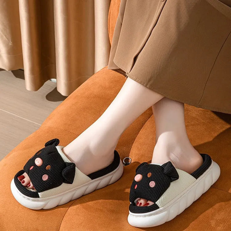 A pair of open-toe linen flip flop slippers for couples, shown in a choice of colours with a cushioned footbed.